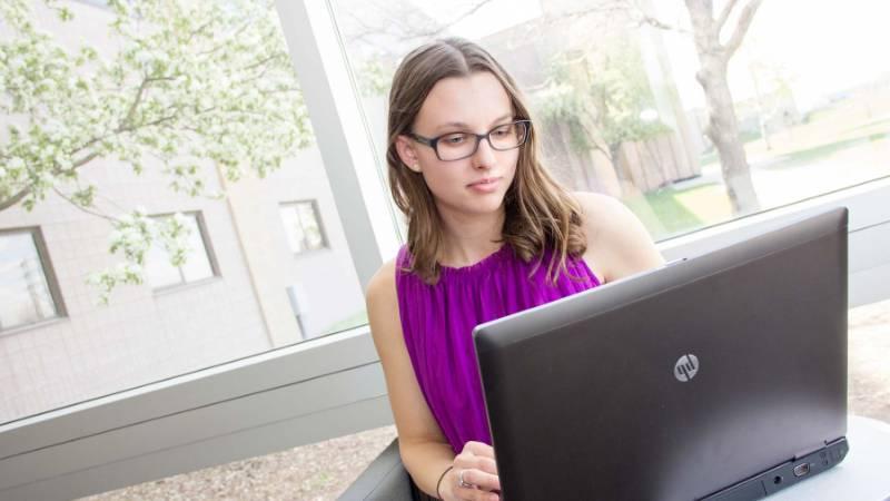 Female Student with Laptop